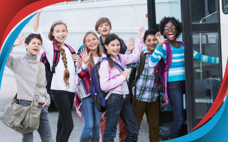 students posing in front of a coach smiling happy faces, school trip destination, June 2024, UK